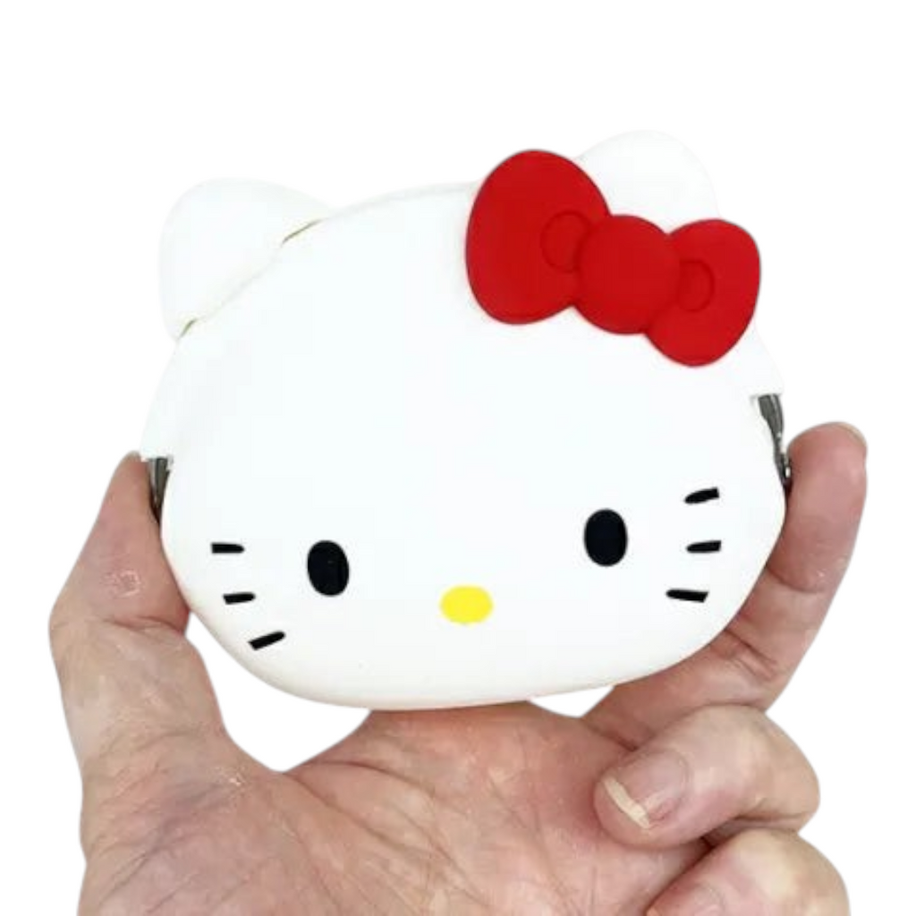 Twinkle Glory white silicone Hello Kitty Mimi Pochi coin pouch with iconic red bow held in a hand
