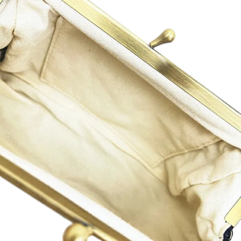 Twinkle Glory Sanrio My Melody pen pouch interior showing the cream cotton lining and brass kiss-lock clasp