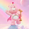 Pink teddy bear with rainbow cape and microphone on a colorful background
