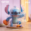 Disney Stitch toy figure in a clear dome on a wooden surface with a blurred background