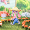 Animated character in a garden with flowers and a basket of carrots