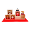 Twinkle Glory Japanese lucky charm set featuring ceramic-style resin figurines of a cat, owl, daruma, and more in boxes