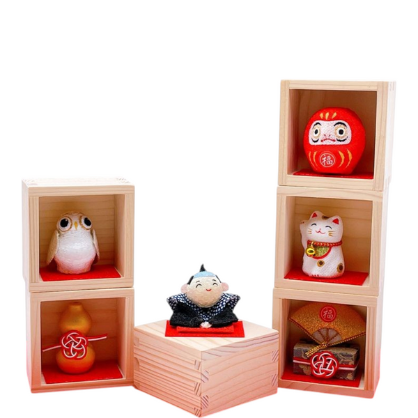 Twinkle Glory Japanese lucky charm set featuring a Daruma, Maneki-neko, owl, and gourd in wooden display boxes.
