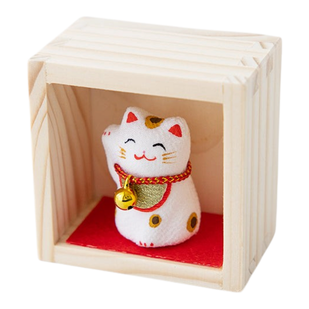 Twinkle Glory white lucky cat figurine with a gold bell in a small wooden display box on a red base