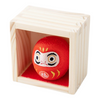 Twinkle Glory red Daruma doll figurine inside a small wooden crate, a Japanese symbol for good luck and fortune.