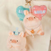Lulu the Piggy Balloon Plush Keychain with Blue Bow
