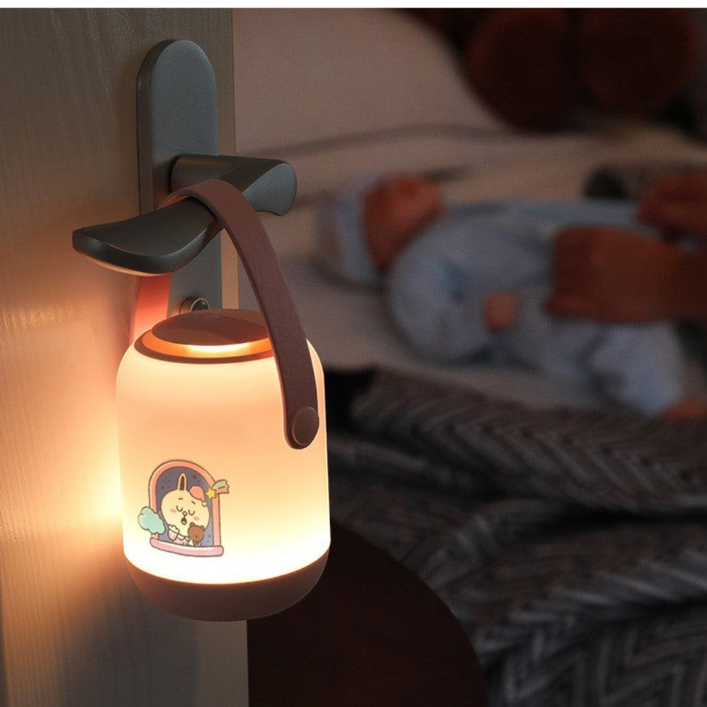 Twinkle Glory NVC Line Friends portable LED night light with a soft glow and round handle hanging on a door knob