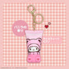 Pink keychain with cartoon character on a pink checkered background