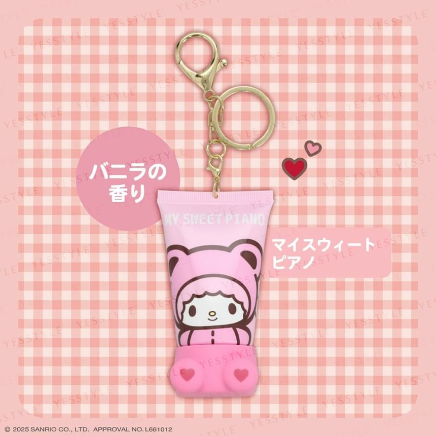 Pink keychain with cartoon character on a pink checkered background
