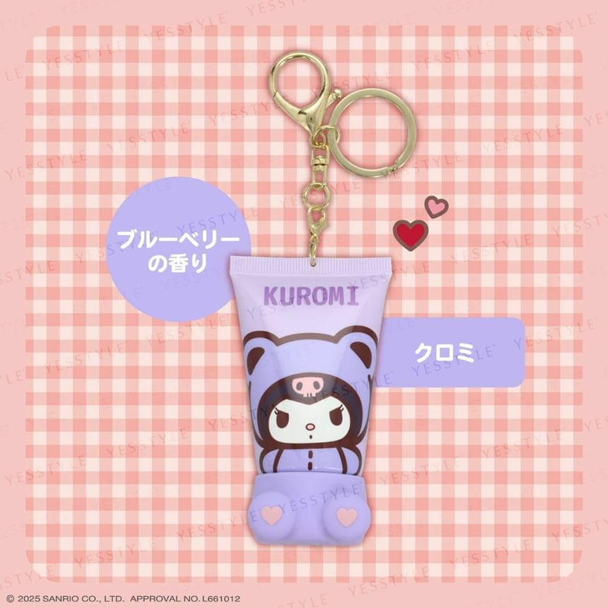 Kuromi character keychain with a small tube on a pink checkered background