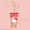 Hello Kitty keychain on a pink checkered background with size indication.