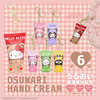 Set of Hello Kitty and friends hand cream keychains on a pink checkered background