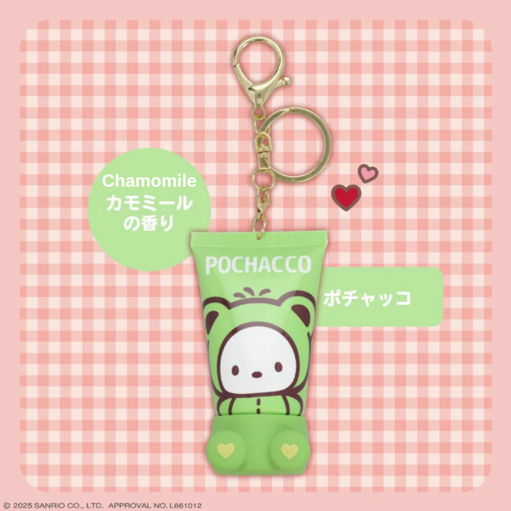 Pochacco keychain with green packaging on a pink checkered background