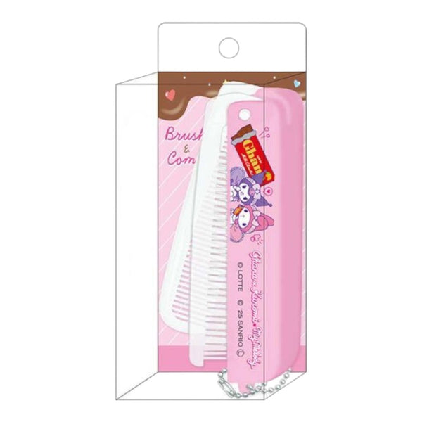 A pink and white hairbrush set in a clear plastic retail package with a printed backing card. The brush has cartoon character graphics and a small red-and-yellow tag, shown against a plain white background.