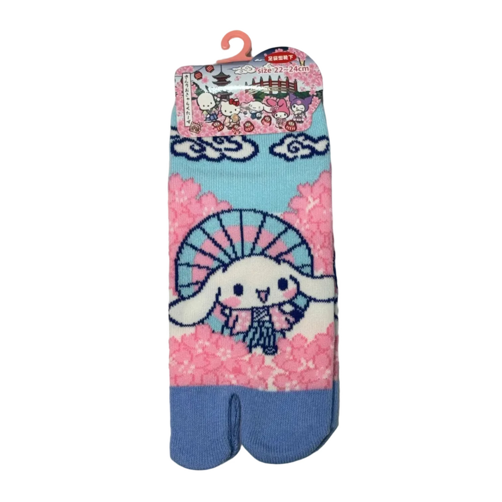 Pair of cartoon-themed tabi socks with a bunny design on a light gray background