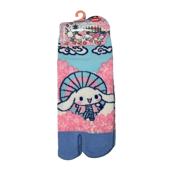 Pair of cartoon-themed tabi socks with a bunny design on a light gray background