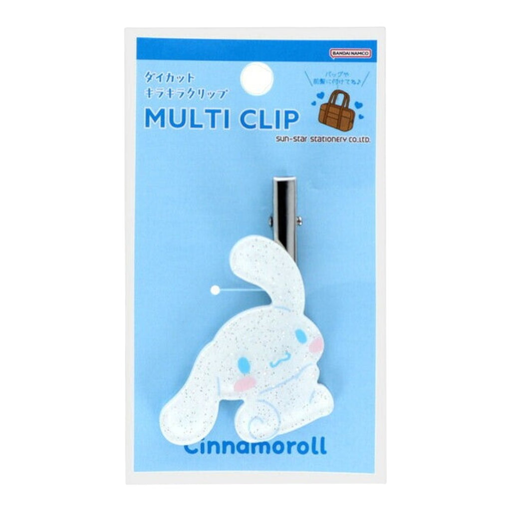 A multi-clip hair accessory featuring a white glittery Cinnamoroll bunny figure with a silver metal clip, presented on its original light blue packaging card.