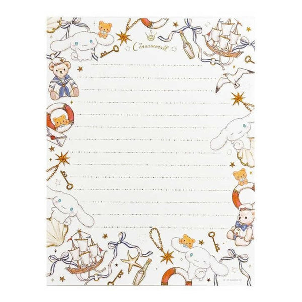 A lined notepad with a cute nautical-themed border featuring cartoon bears, seals, ships, stars, keys, and life preservers on an off-white background.