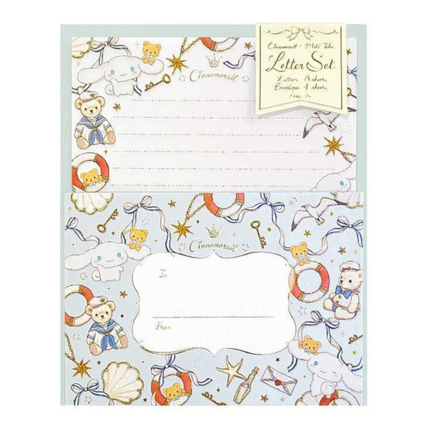 A commemorative letter set with a light blue envelope decorated with teddy bears, sea life illustrations, and gold stars, paired with lined white letter paper.