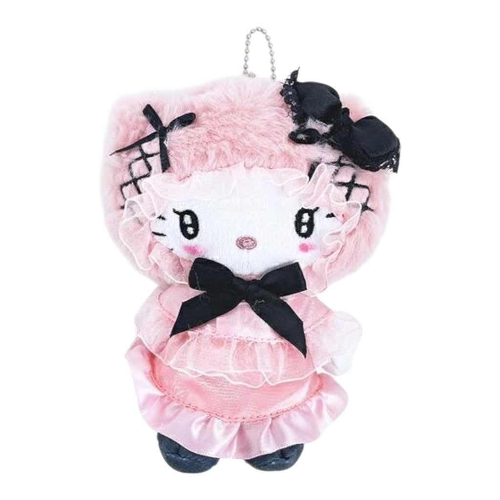 A pink Hello Kitty plush keychain charm with a fluffy pink hairpiece, black bows, and a ruffled pink dress, shown on a plain white background.