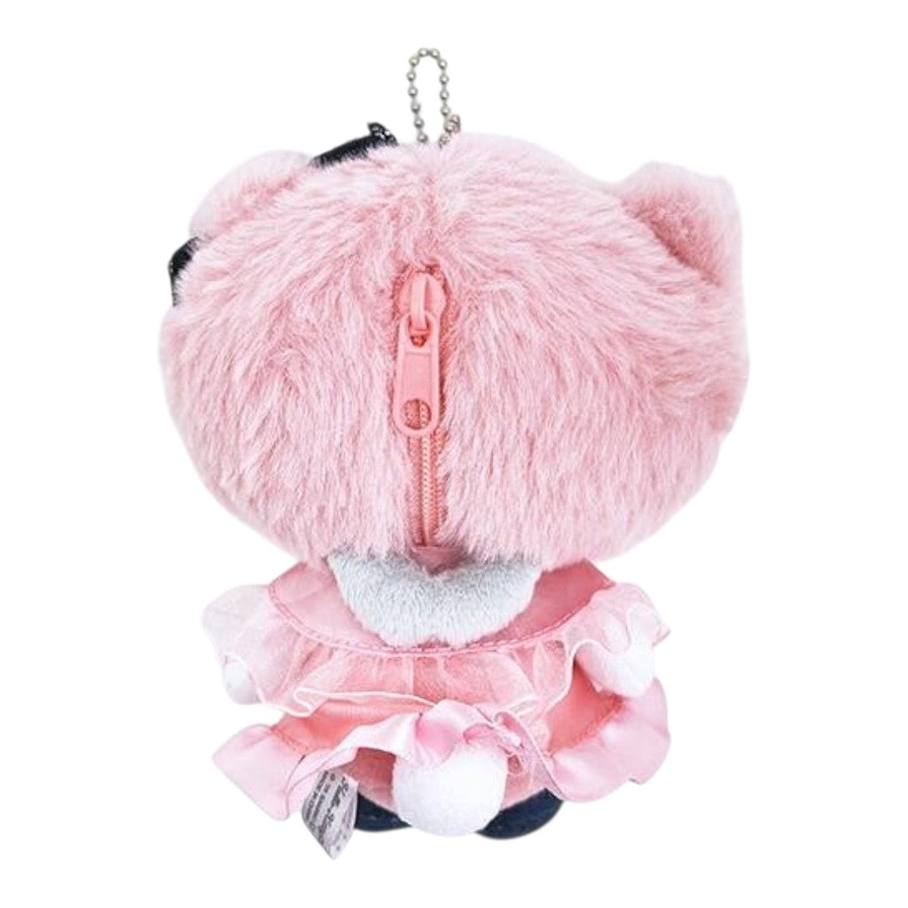A pink plush character keychain or pouch shown from the back, featuring fluffy pink fur, a pink zipper, a silver ball chain, and a ruffled pink skirt with white pom-poms.