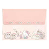 A pink Hello Kitty themed envelope or card with a decorated flap. The flap features a row of small bows and the bottom border is illustrated with various cute Hello Kitty cats, a teddy bear, and a heart.