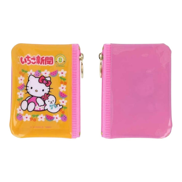 Two pink zippered Hello Kitty coin purses shown side by side on a white background. The left purse has a yellow-orange front with a Hello Kitty illustration and Japanese text, and the right purse is plain pink with a glossy finish.