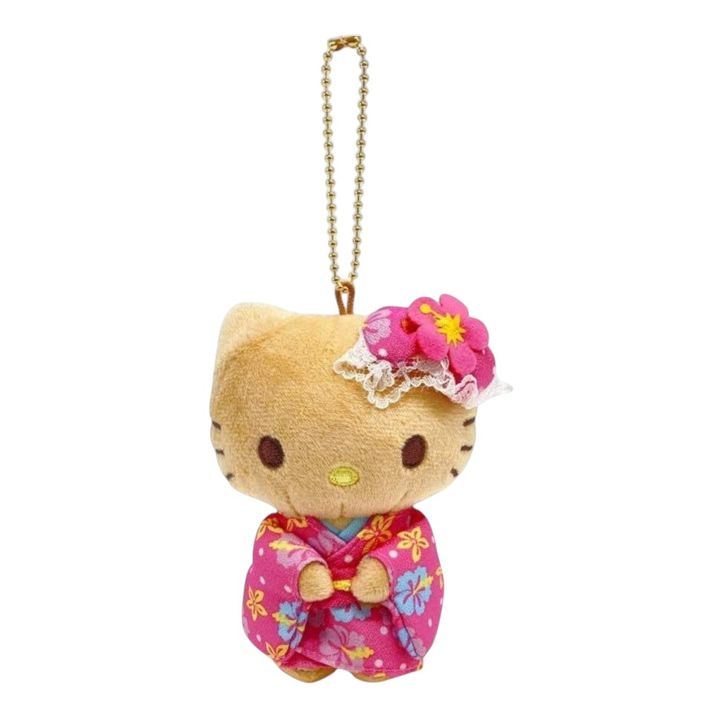 A Hello Kitty plush keychain charm in a pink floral kimono with a pink flower headband, attached to a gold ball chain, on a plain white background.