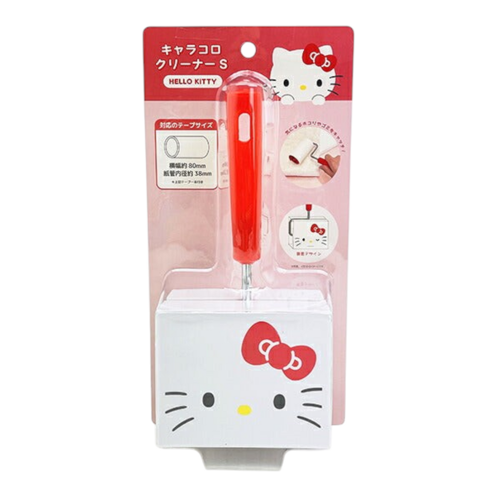 Hello Kitty hand-held cleaning brush in retail packaging, with a red handle and a white brush head printed with Hello Kitty's face and bow, on a plain white background.