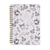A spiral-bound notebook featuring a light lavender cover decorated with cute cartoon characters, bows, crowns, and gold script text, bound with a gold-tone spiral on a white background.
