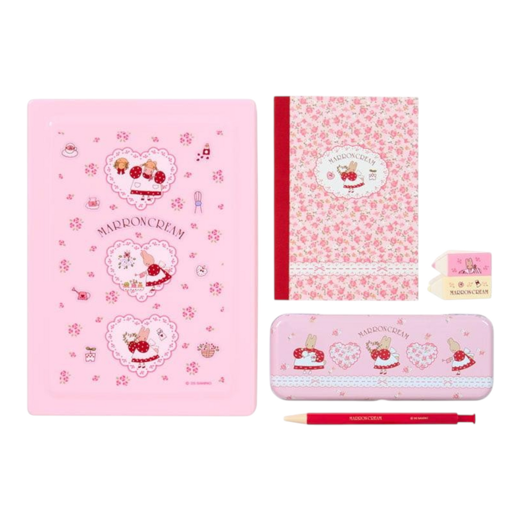 A pink Madelon Day stationery set featuring a notebook, pencil case, pencil, and erasers on a white background.
