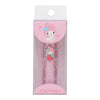 A pink My Melody branded pen or accessory inside a clear plastic blister pack with a white cardboard hanger tab. The packaging features a pink My Melody illustration, and the pen itself has a strawberry-themed charm.