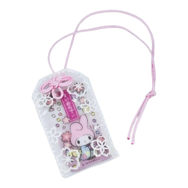 A Sanrio My Melody luggage tag charm featuring a pink character illustration, decorated with white lace patterns, small flowers, and a pink ribbon bow, complete with a pink hanging cord.