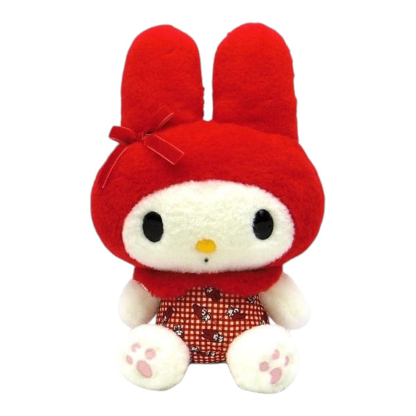 A red and white plush toy character with long upright ears, a small red bow, a yellow nose, and a red-and-white patterned outfit, photographed on a plain white background.