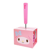 A pink My Melody toilet paper holder with a matching pink handle, featuring a printed cartoon face and bow on the front, set against a plain white background.