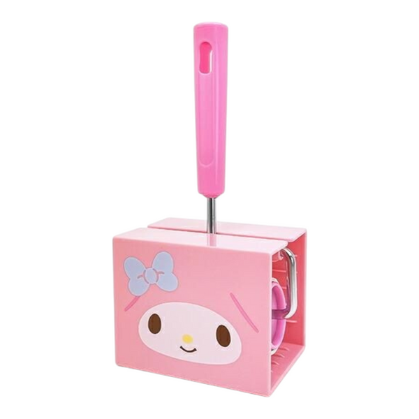 A pink My Melody toilet paper holder with a matching pink handle, featuring a printed cartoon face and bow on the front, set against a plain white background.
