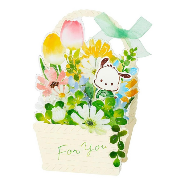 A decorative gift basket card or box featuring layered floral illustrations, including tulips, daisies, and small green leaves, with a cartoon sheep face and a mint green ribbon bow on a white background.