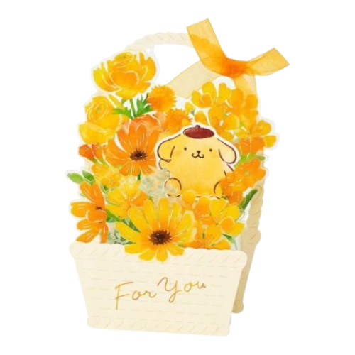 A decorative gift box or card shaped like a basket filled with yellow and orange flowers, featuring a cute cartoon dog character on the front and the words 'For You' written in gold script. The box has a white handle with an orange ribbon bow and is shown on a plain white background.
