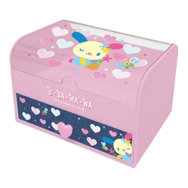 A pink U-S-A-H-A-Na storage box with a clear lid, decorated with pastel hearts, stars, and cartoon bunny characters. The front features a dark blue glittery panel with white hearts and the brand name 'U-S-A-H-A-NA' in white.
