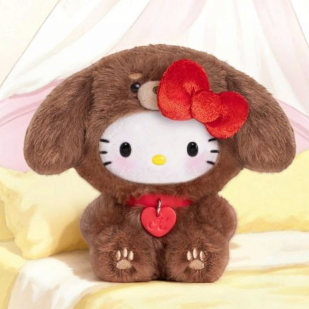Twinkle Glory Hello Kitty plush bag charm dressed in a brown puppy costume with a red bow and heart pendant