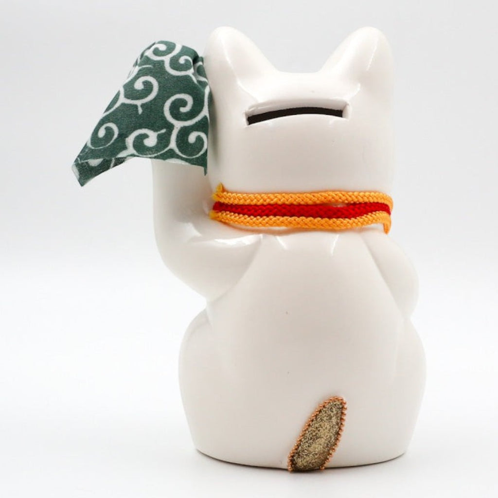 Twinkle Glory Goenneko ceramic lucky cat figurine seen from the back with a green patterned cloth and orange scarf