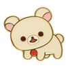 Twinkle Glory San-X Rilakkuma Chairoikoguma metal pin badge featuring a cream bear character with a red button detail