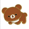 Twinkle Glory San-X Rilakkuma Chairoikoguma metal pin badge with brown enamel and gold-tone trim