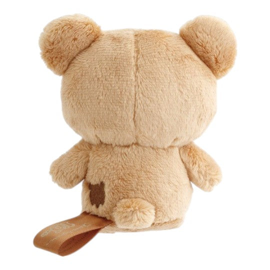 Twinkle Glory San-X Chairoikoguma 10th anniversary plush toy, back view showing soft tan polyester fabric and tag