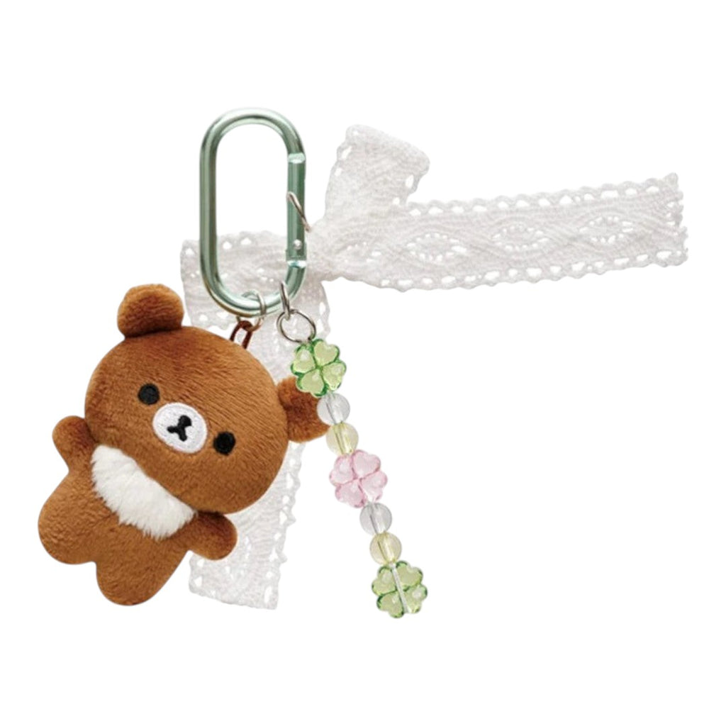 Twinkle Glory San-X Chairoikoguma plush keychain with a white lace ribbon, clover beads, and a metal carabiner clip.
