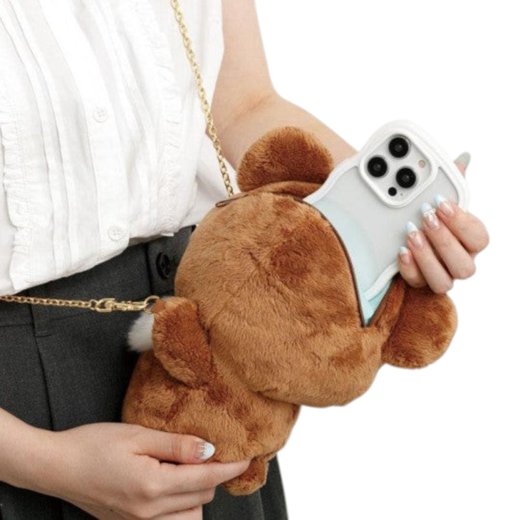 Twinkle Glory San-X Chairoikoguma plush bear pochette with gold chain strap holding a smartphone