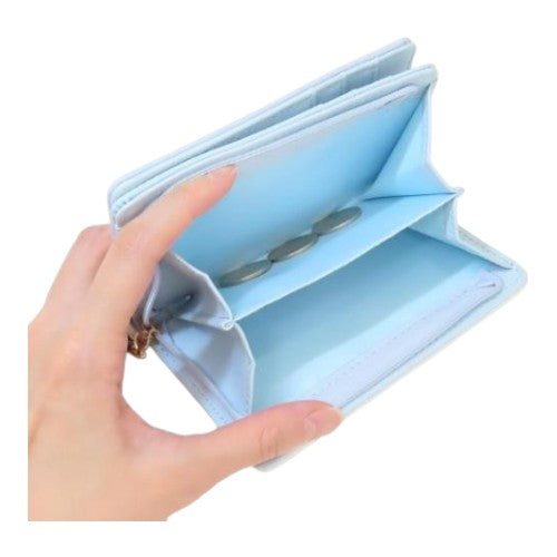 Twinkle Glory Sanrio Cinnamoroll light blue zipper wallet held in hand showing open coin compartment interior