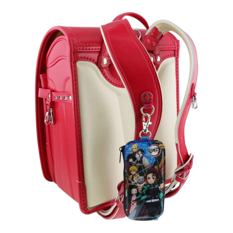 Twinkle Glory Demon Slayer PVC polyester key case with retractable reel attached to a red and cream school backpack