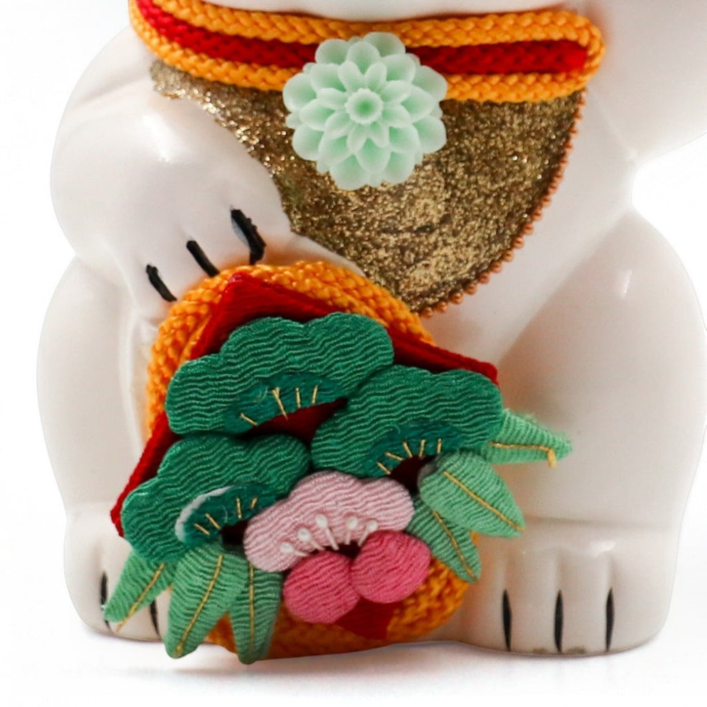 Twinkle Glory Goenneko ceramic lucky cat figurine featuring a festive lion dance costume with intricate floral detail.