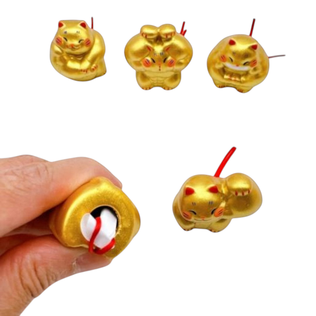 Twinkle Glory gold porcelain lucky cat mascots with muscle design, handmade and hand-painted for good fortune.